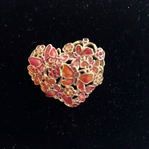 Pink enamel and gold brooch.